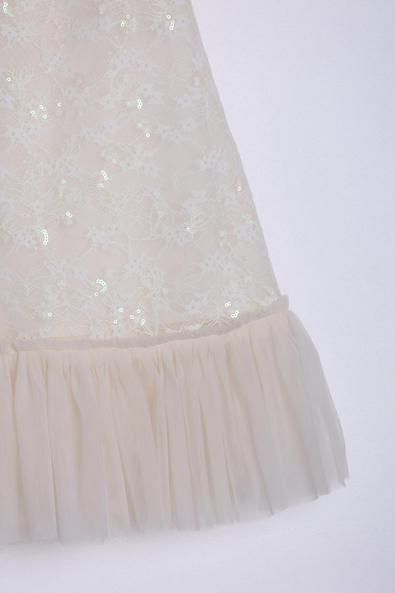 A close-up of the KIKI and JOJO Puff Sleeve Tulle Cheongsam Dress, featuring pearl-embroidered cuffs.