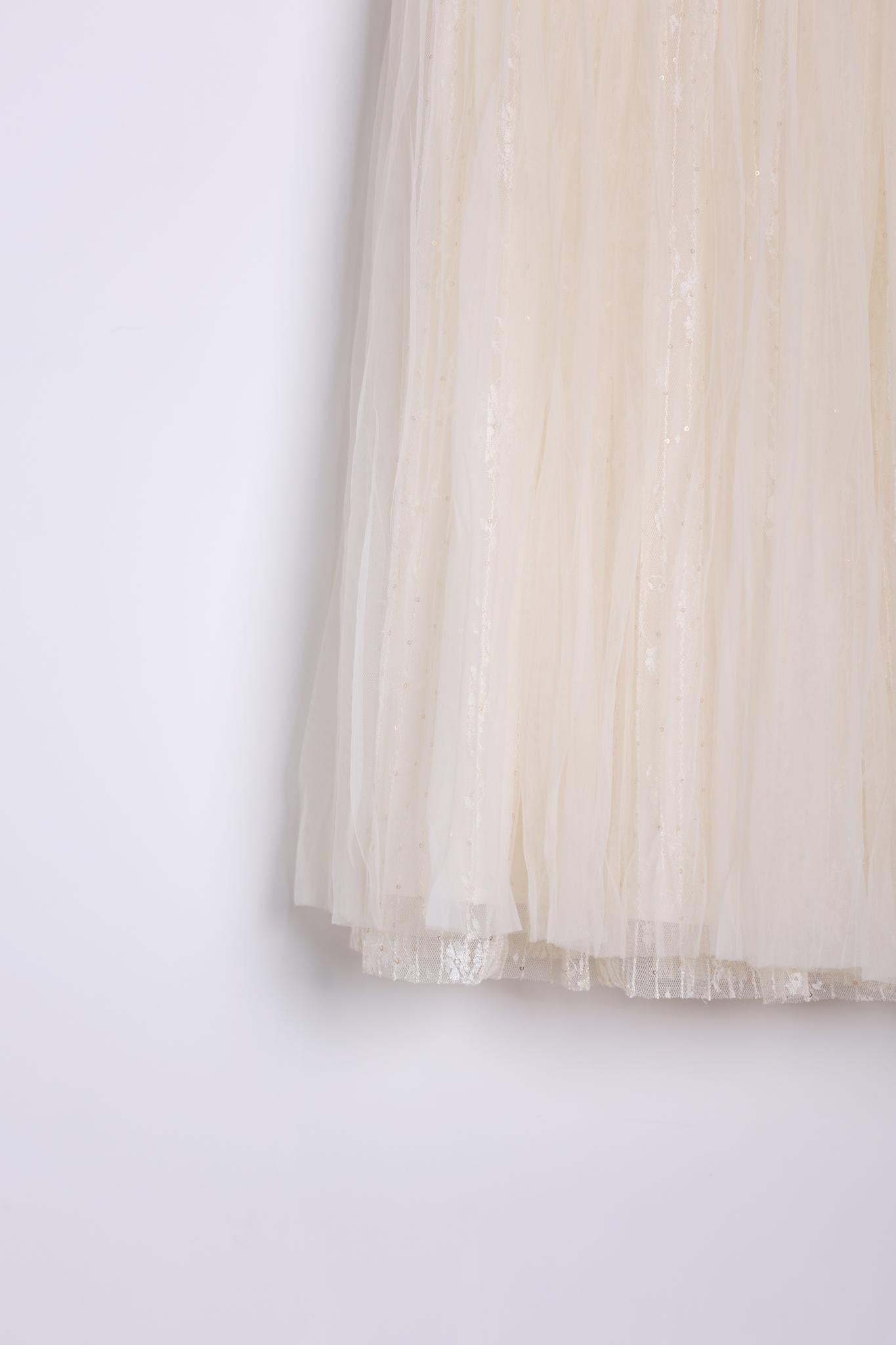 Close-up of the KIKI and JOJO Girls Dreamy Sequined Tulle Skirt, featuring cream-colored tulle with subtle shimmer accents and a silver satin waistband, shown against a plain white background.