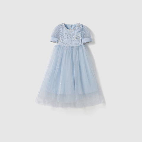 The Mist Whisper Dress by KIKI and JOJO is a light blue A-line dress for girls with hand-embroidered floral details and pearl trim on the bodice, layered tulle skirt, shown against a plain white background.
