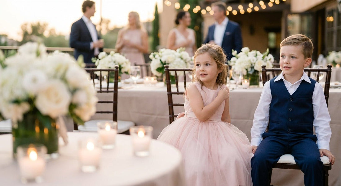 Young girl in a blush tulle dress and boy in a vest and dress shirt at an evening rehearsal dinner