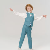 A young child in a teal suit, white shirt, and bow tie stands with arms outstretched against a plain white background.