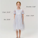 A young girl aged 6-7 models the Mist Whisper Dress by KIKI and JOJO in light blue with silver shoes, standing against a plain background. Her chest, hip, shoulder, and waist measurements are labeled for size reference.