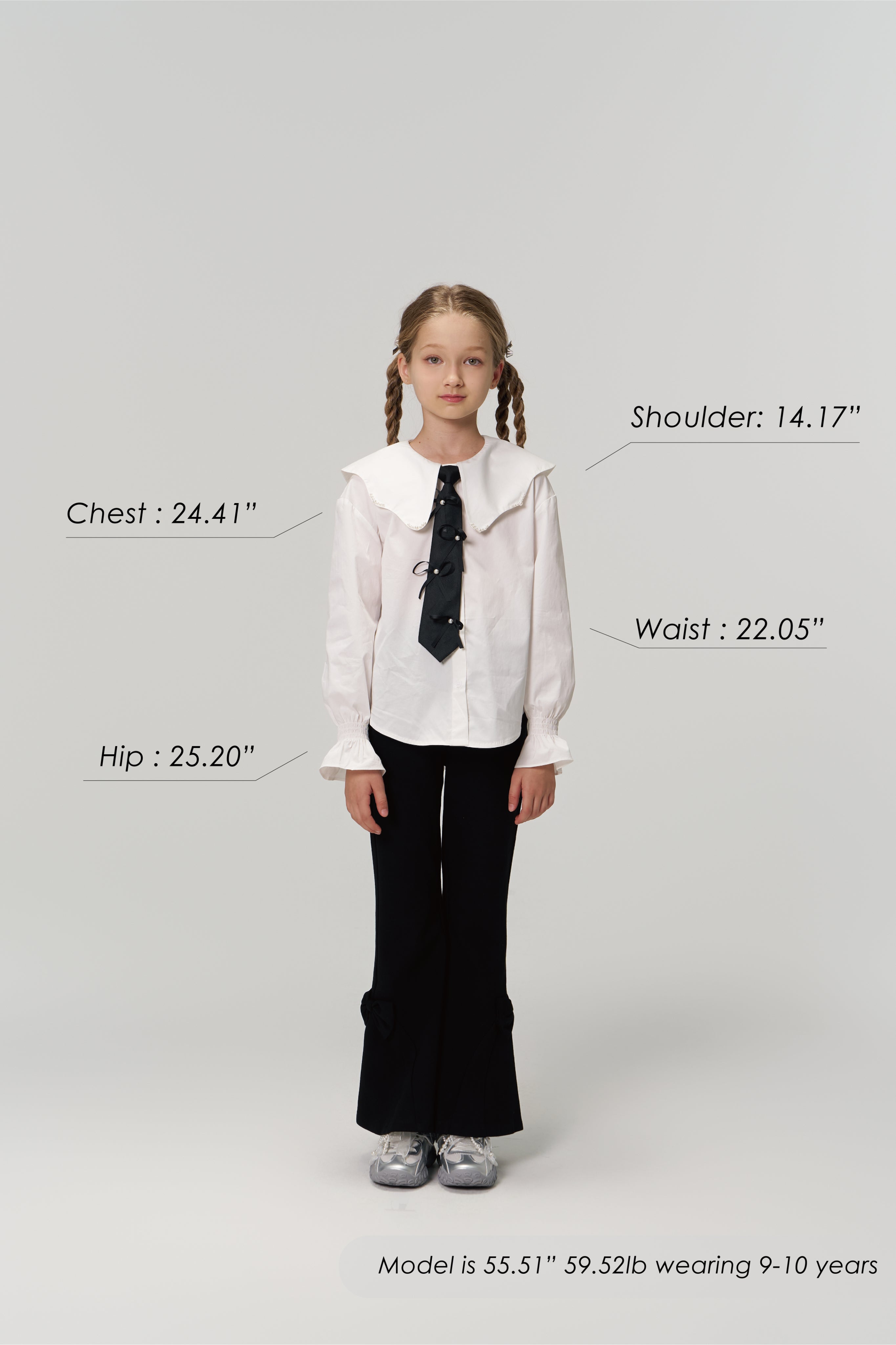 A young girl models KIKI and JOJO's Petal Whisper Dress Pants, featuring a flared silhouette and elastic waistband, paired with a white blouse and sneakers. Measurement labels for chest, shoulder, waist, hip, plus model’s height and weight are shown.