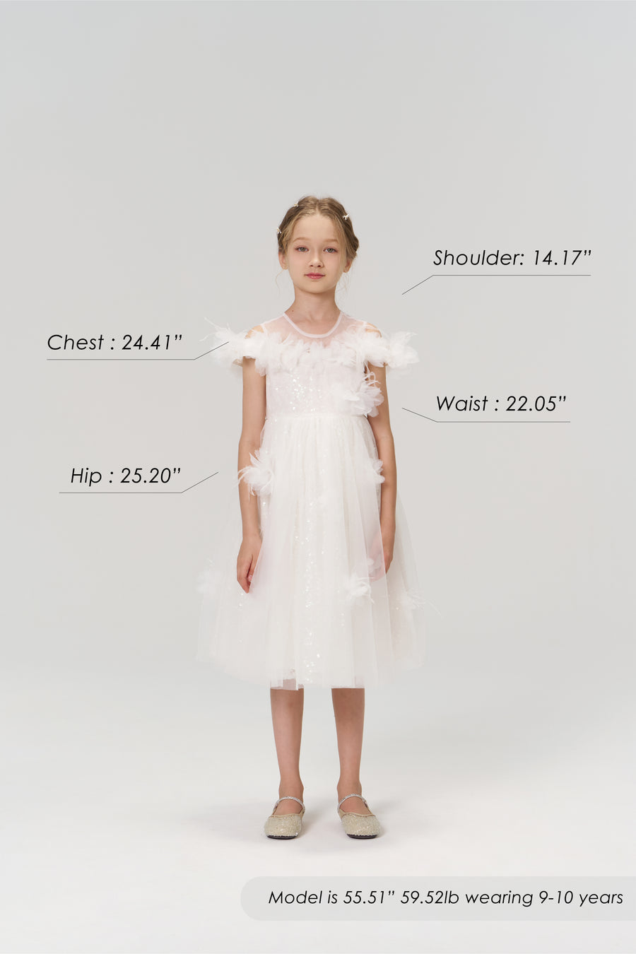 Young girl wears the KIKI and JOJO Feathered Whisper Dress - Blue with flats, posing against a plain background. Her body measurements, height, weight, and age are labeled to showcase an ethereal elegance look.
