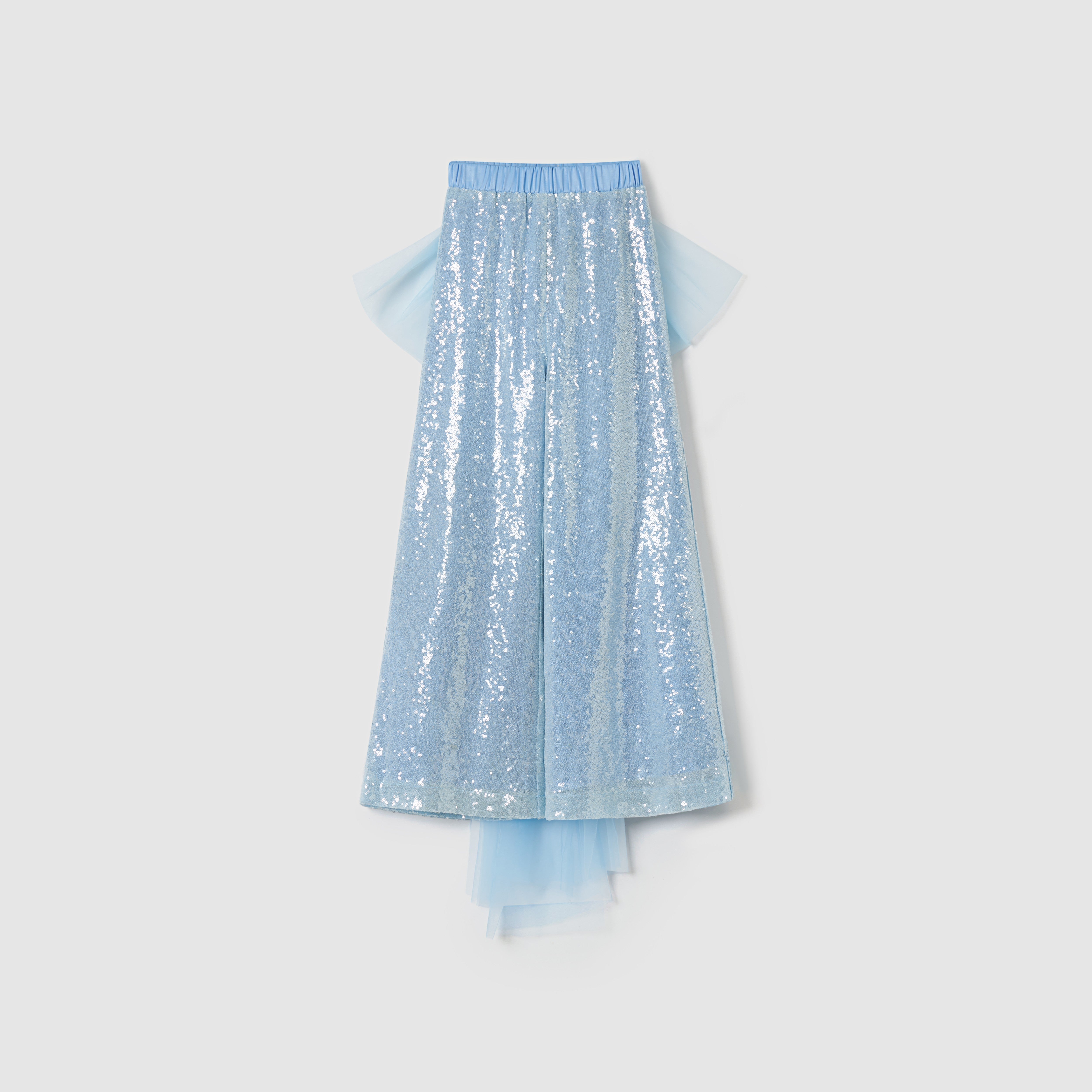 The KIKI and JOJO Radiance Sequin Wide-leg Pants feature a light blue sequin design, an elastic waistband, layered tulle accents, and a detachable bow, displayed against a plain white background.
