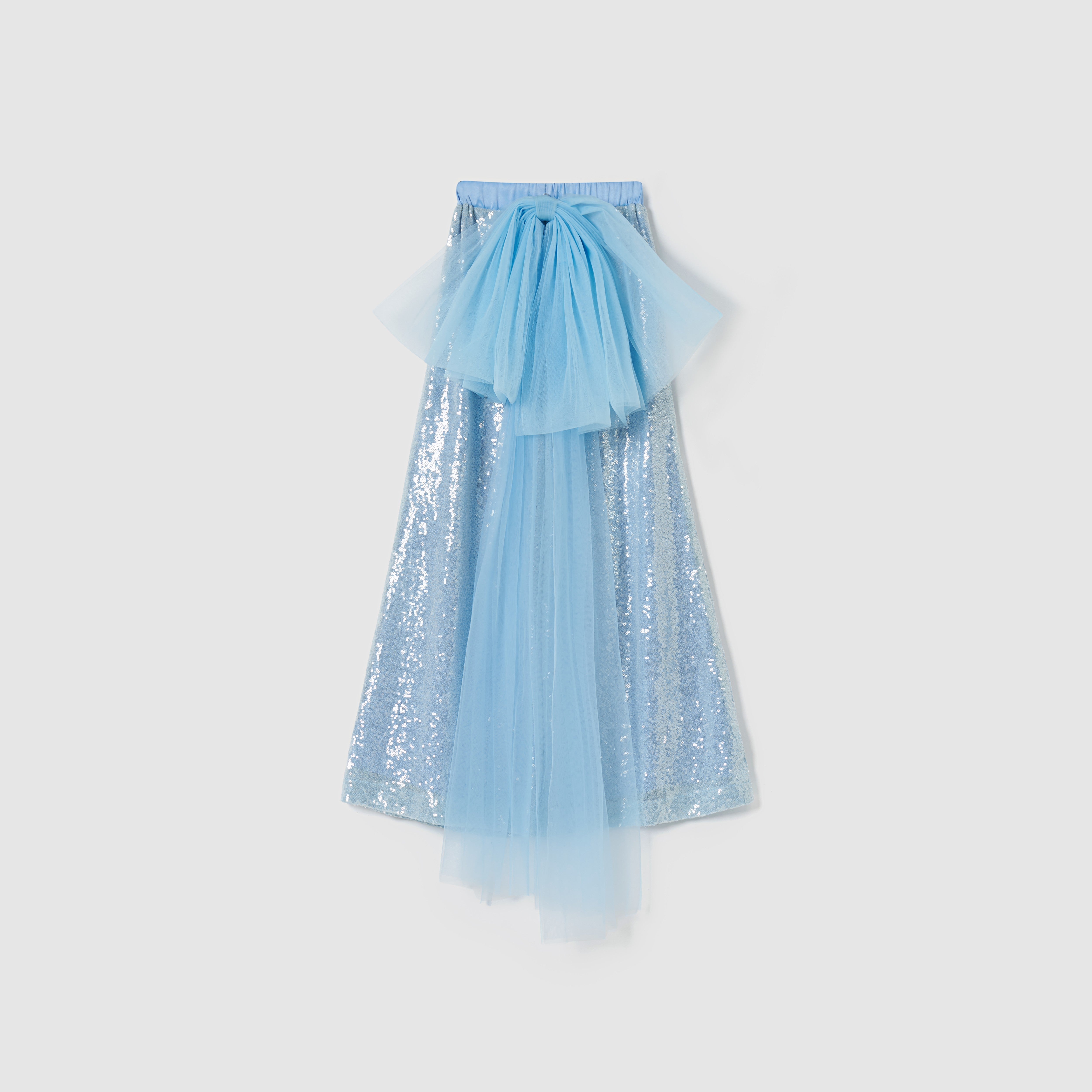 Radiance Sequin Wide-leg Pants by KIKI and JOJO, in light blue with a detachable tulle bow and overlay at the waist, shown against a plain white background.