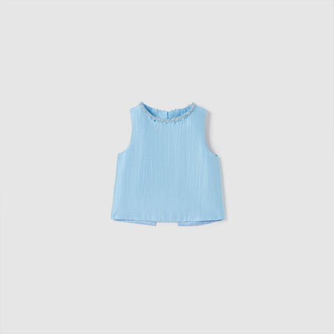 The KIKI and JOJO Radiance Satin Crop Top is a sleeveless light blue crop top featuring a round neckline and luminous textured satin fabric, showcased against a plain white background.