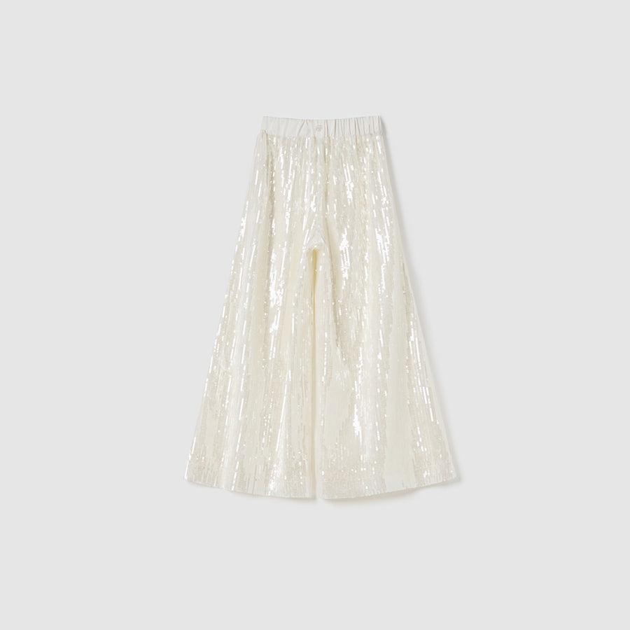 KIKI and JOJO Radiance Sequin Wide-Leg Pants in white feature a high-rise design and elastic waistband, shown on a plain light grey background.