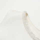 Close-up of the Radiance Satin Crop Top by KIKI and JOJO, featuring a hand-beaded pearl neckline, photographed against a plain white background.