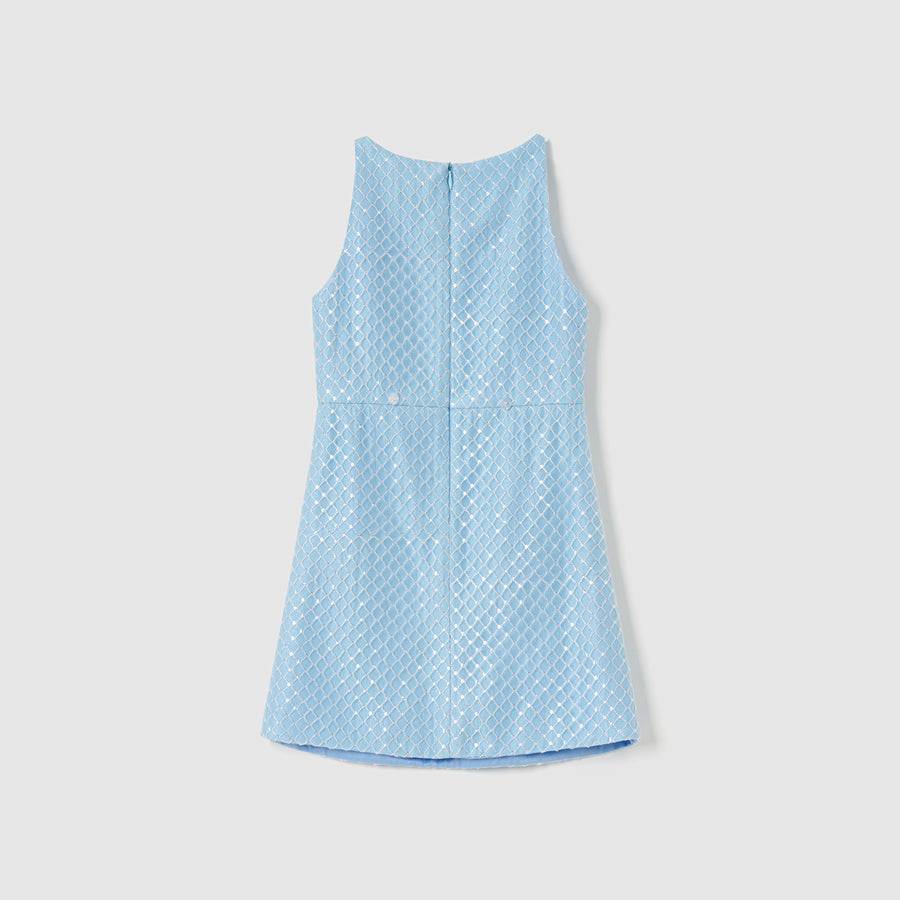 KIKI and JOJO’s Radiance Sequin Overlay Dress in light blue features a sleeveless, diamond-patterned texture. Shown from the back on a plain white background.