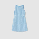 The KIKI and JOJO Radiance Sequin Overlay Dress is a sleeveless light blue formal dress, featuring a diamond-pattern texture, front buttons at the waist, and a back zipper, shown on a plain white background.