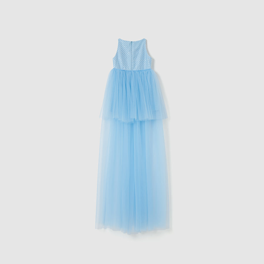 The Radiance Sequin Overlay Dress by KIKI and JOJO is a sleeveless, floor-length blue tulle dress with a fitted bodice and layered skirt, shown against a plain white background.