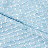 Close-up of KIKI and JOJO's Radiance Sequin Overlay Dress, featuring blue sequin tulle with a diamond pattern and a matching blue zipper, ideal for formal occasions.