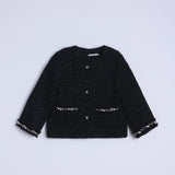 The Girls Tweed Jacket – Classic Black Pearl by KIKI and JOJO is a black, long-sleeve tweed jacket with button-up front, hand-beaded details, front pockets, and decorative trim on a plain light background.