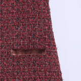 Close-up of KIKI and JOJO's Girls Handmade Tweed Dress – Burgundy Velvet Bow, showcasing its small velvet-trimmed pocket, armhole, and detachable velvet bows against a plain light background.