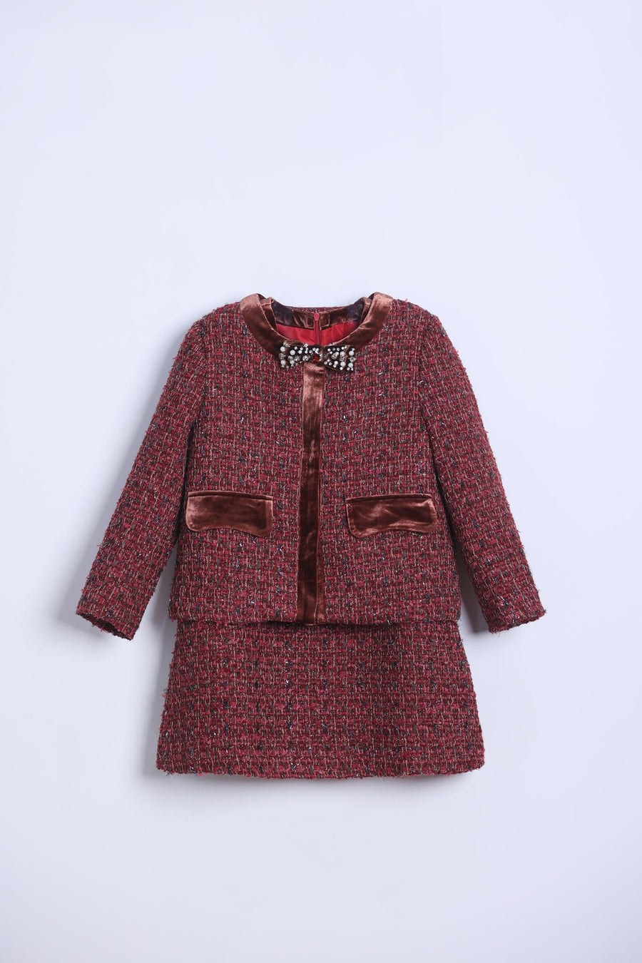 KIKI and JOJO’s Girls Handmade Tweed Dress – Burgundy Velvet Bow features a burgundy tweed dress with velvet-lined collar and detachable bows, paired with a matching skirt, displayed on a light background.