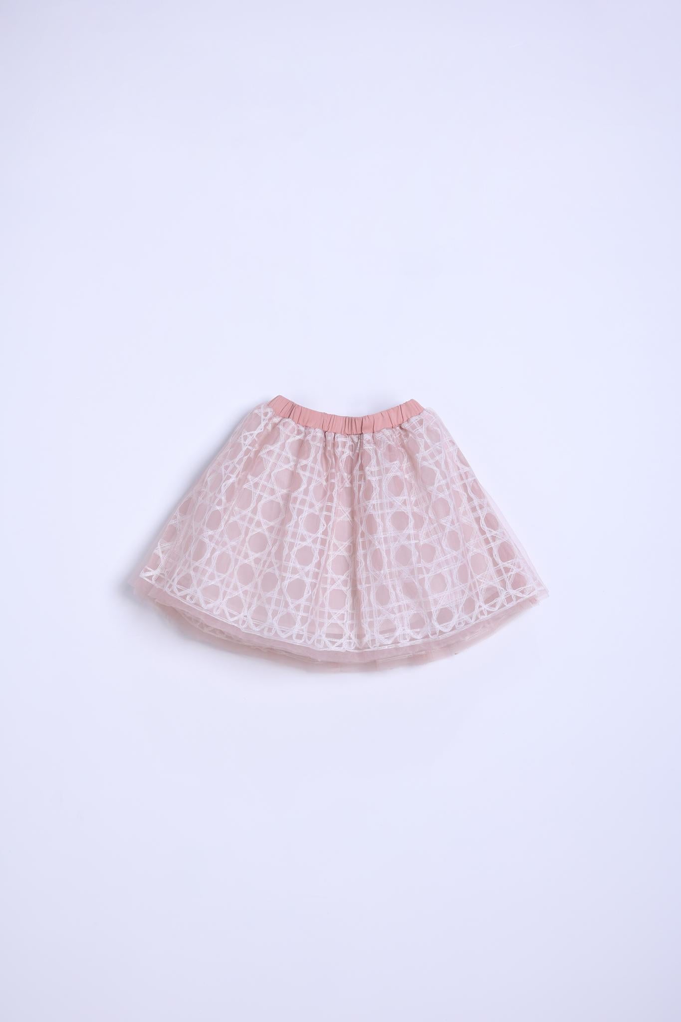 The KIKI and JOJO Girls Tulle Skirt – Darling Blush Pink is knee-length with an elastic waistband, featuring a lace-embroidered overlay, and is shown against a plain white background.