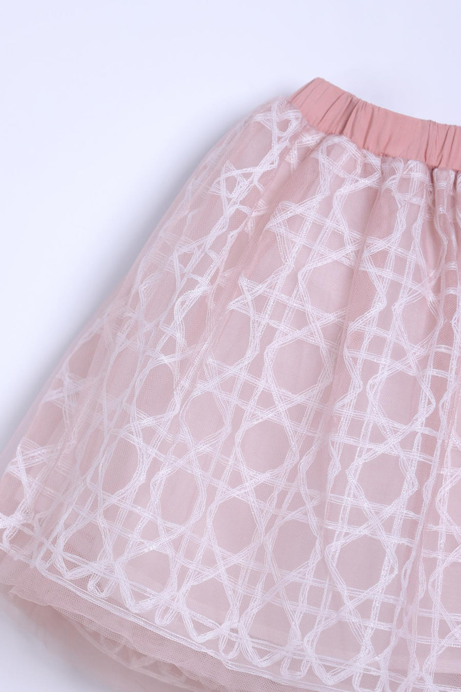 The Girls Tulle Skirt – Darling Blush Pink by KIKI and JOJO features blush pink tulle with a white lace-embroidered overlay and solid pink elastic waistband, shown against a plain background.