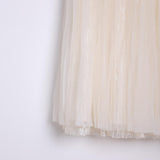 Close-up of the KIKI and JOJO Girls Dreamy Sequined Tulle Skirt, featuring cream-colored tulle with subtle shimmer accents and a silver satin waistband, shown against a plain white background.