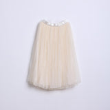 The KIKI and JOJO Girls Dreamy Sequined Tulle Skirt features a cream-colored tulle design with a silver satin waistband, shown against a plain white background.