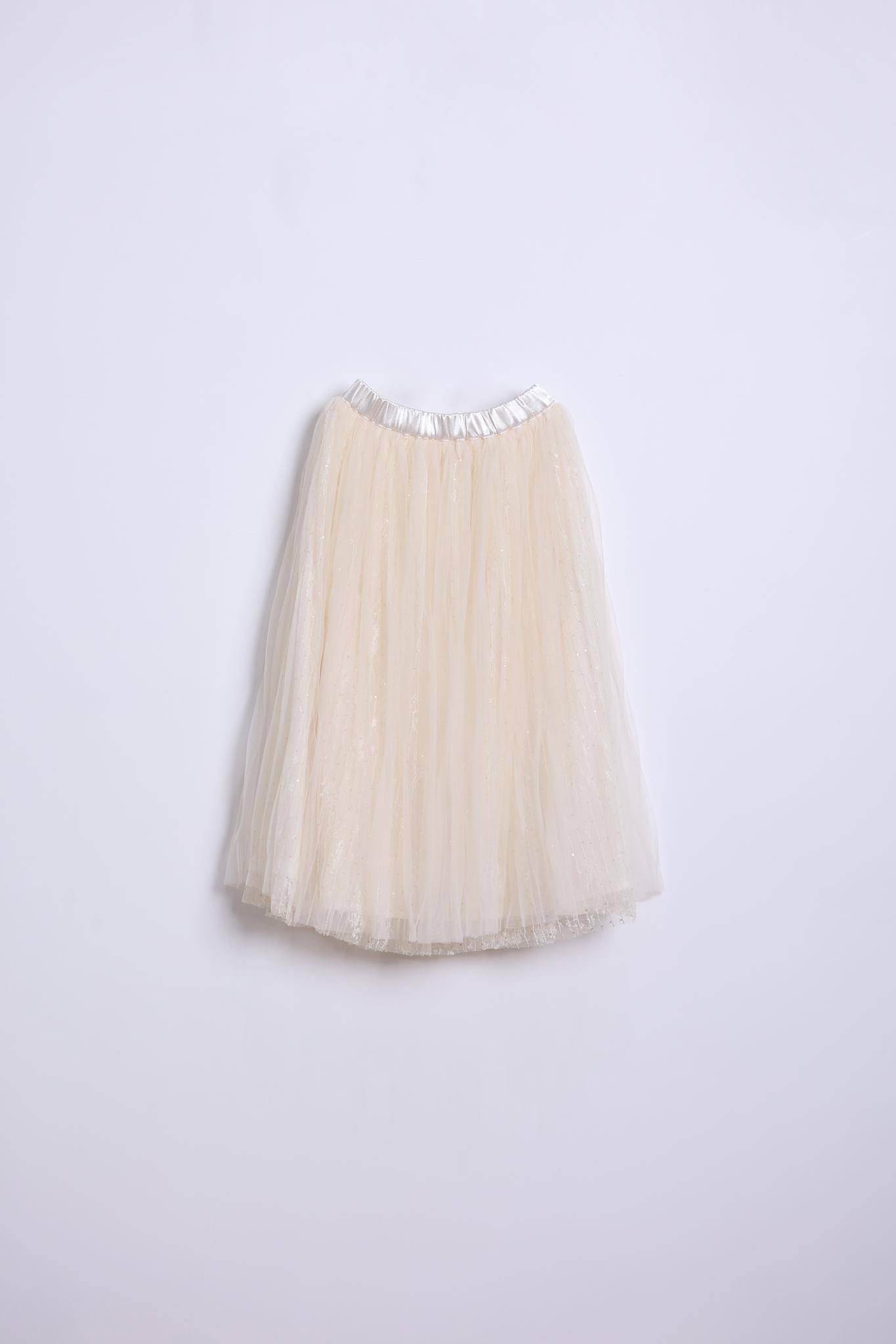 The KIKI and JOJO Girls Dreamy Sequined Tulle Skirt features a cream-colored tulle design with a silver satin waistband, shown against a plain white background.