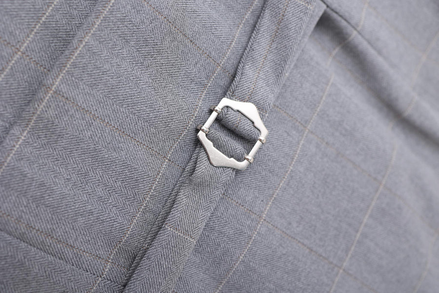 Close-up of a silver buckle on the Kids Suit – Gray 3-Piece Set by KIKI and JOJO, featuring classic-fit checkered fabric with subtle herringbone—ideal for stylish kids ages 3-14.