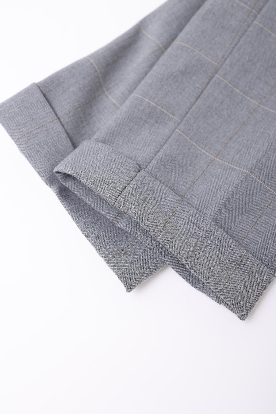 Close-up of KIKI and JOJO Kids Suit Pants – Light Gray, Checkered, Adjustable (3-14 Years), featuring fine-woven plaid fabric with a subtle herringbone pattern, showcased against a white background.