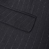 Close-up of the KIKI and JOJO Kids Suit Jacket – Black (3-14 Years) in classic fit, made from wrinkle-free fabric with fine white pinstripes and a flap pocket detail.