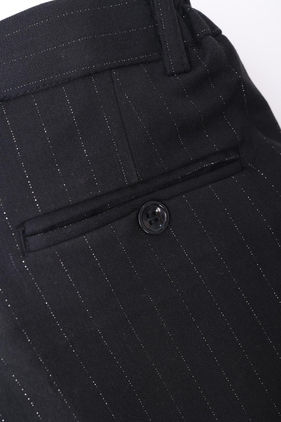 Close-up of the back pocket on KIKI and JOJO Kids Suit Pants – Black (3-14 Years), classic fit and wrinkle-free, featuring a single button closure.