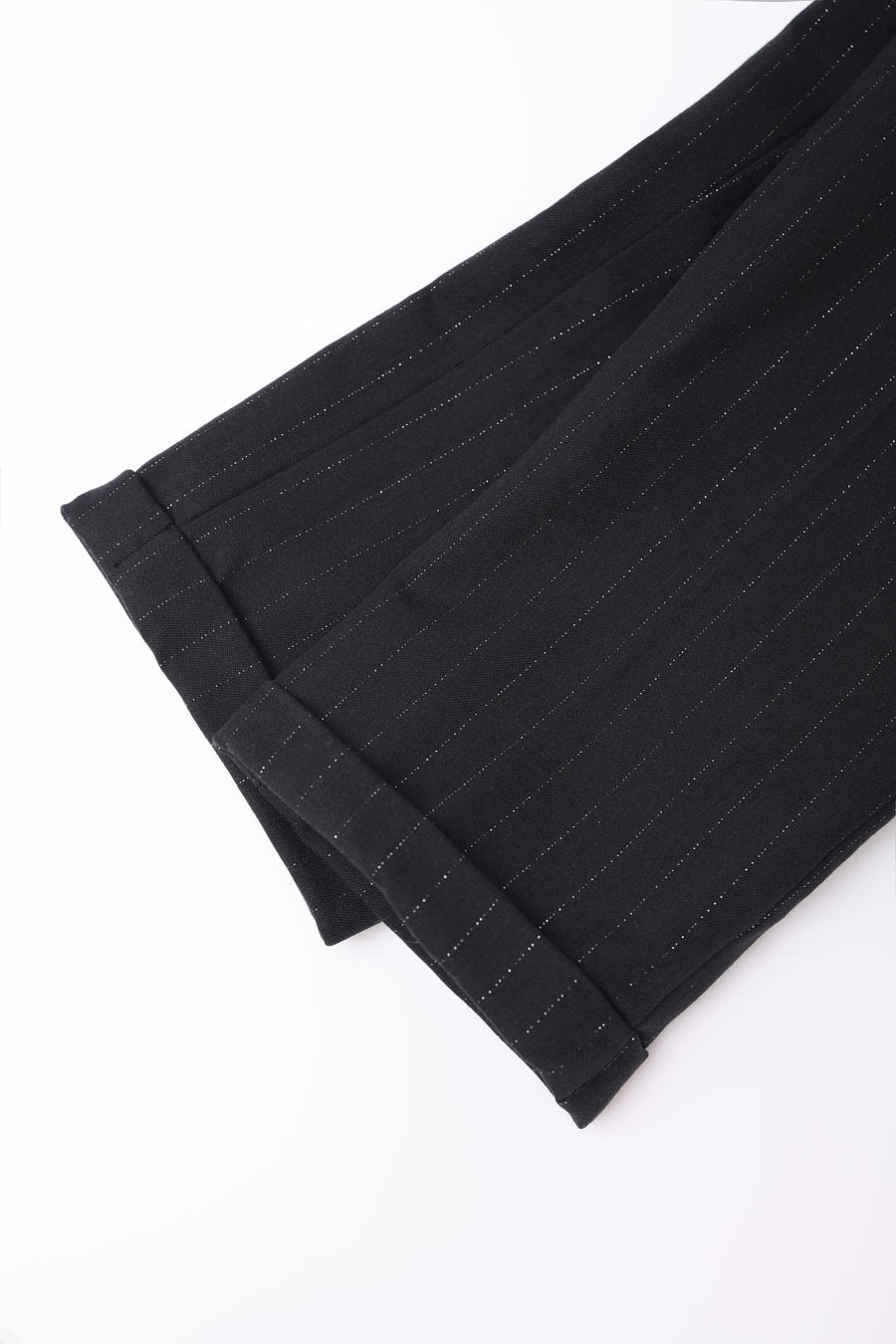 Close-up of the cuffed hem on KIKI and JOJO Kids Suit Pants – Black (3-14 Years) – Classic Fit – Wrinkle-Free, shown against a white background.
