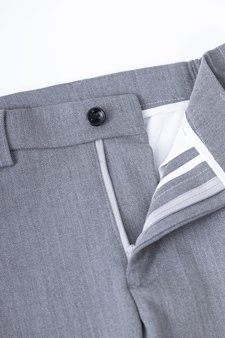 Close-up of the waistband and zipper on KIKI and JOJO's Kids Suit – Gray 3-Piece Set (3-14 Years), classic fit with button closure and white pocket lining, ideal for completing a wrinkle-free formal look.