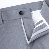 Close-up of KIKI and JOJO Gray Kids Suit Pants (3-14 Years), classic fit, with a waistband, black button, zipper, and inner white lining. Crafted from wrinkle-free fabric for a sharp look all day.