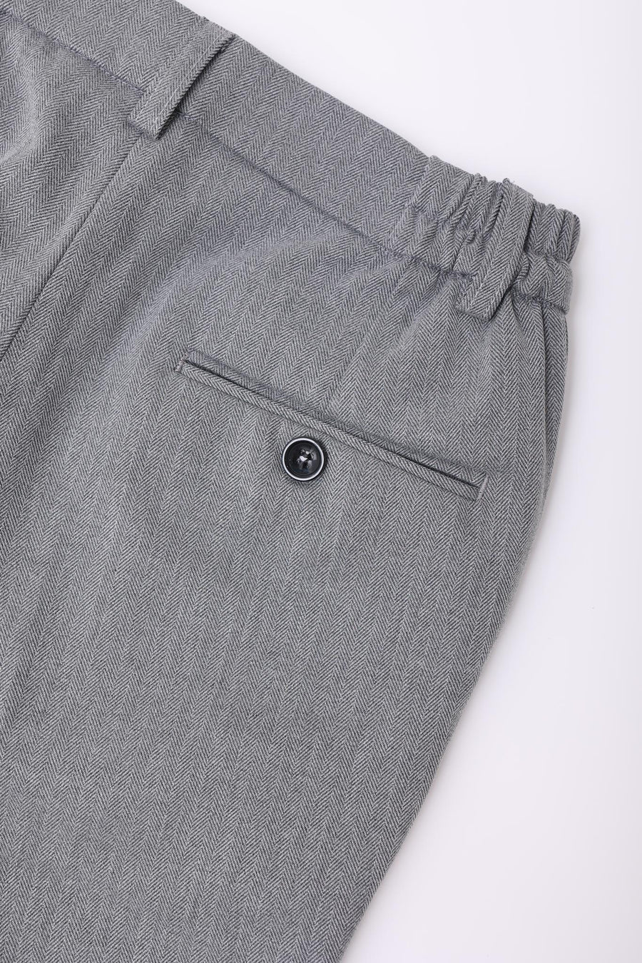 Close-up of KIKI and JOJO Kids Suit – Gray 3-Piece Set (ages 3-14), classic fit and wrinkle-free, showcasing dress pants with an elastic waistband and a single buttoned back pocket.