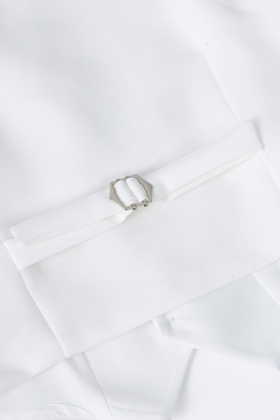 Close-up of the KIKI and JOJO Kids Suit Vest in white, classic fit, wrinkle-free fabric, available for ages 3-14.