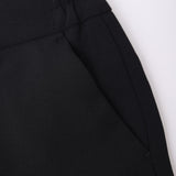 Close-up of the elastic waistband and side pocket seam on KIKI and JOJO Kids Suit Pants – Black (3-14 Years), featuring slim-fit design and wrinkle-free fabric.