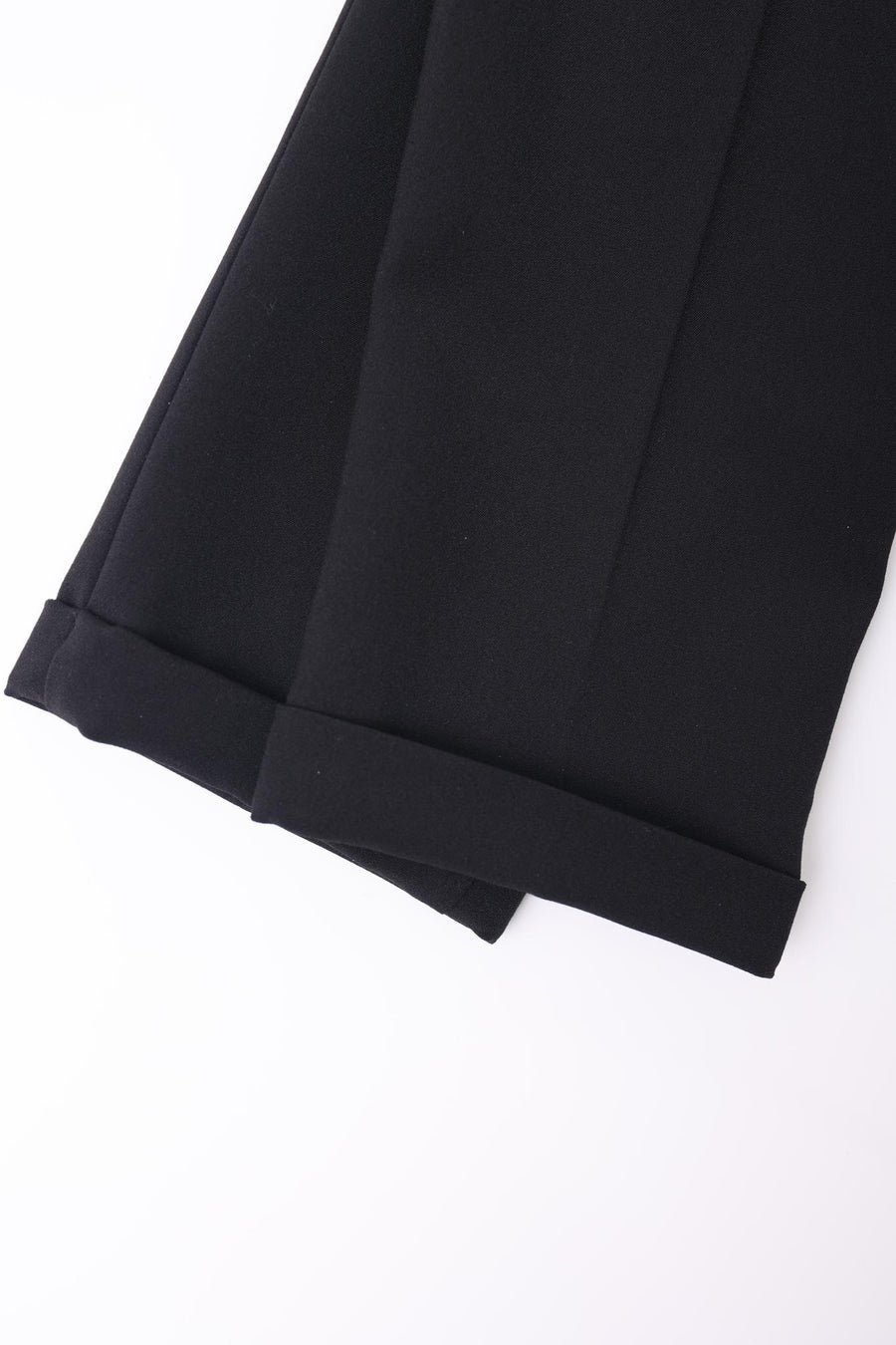 Two KIKI and JOJO Kids Suit Black 2-Piece Sets (Slim Fit, Wrinkle-Free, Ages 3-14) are displayed on a white surface with hems and cuffs visible.
