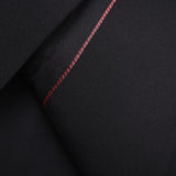 Close-up of the KIKI and JOJO Slim-Fit Black Kids Suit Jacket (3-14 Years), made from wrinkle-free fabric, with a subtle red stitched accent and a single black button on the sleeve.