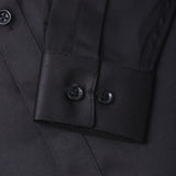 Close-up of the KIKI and JOJO Kids Dress Shirt – Black Long Sleeve (3-14 Years) – Classic Fit, highlighting the sleeve cuff with two black buttons and front buttons for a timeless look.