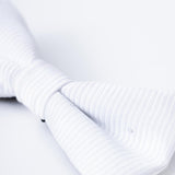 Close-up of the KIKI and JOJO Kids Bow Tie – White & Black, a pre-tied satin accessory with an adjustable fit, shown against a plain white background for a timeless style.