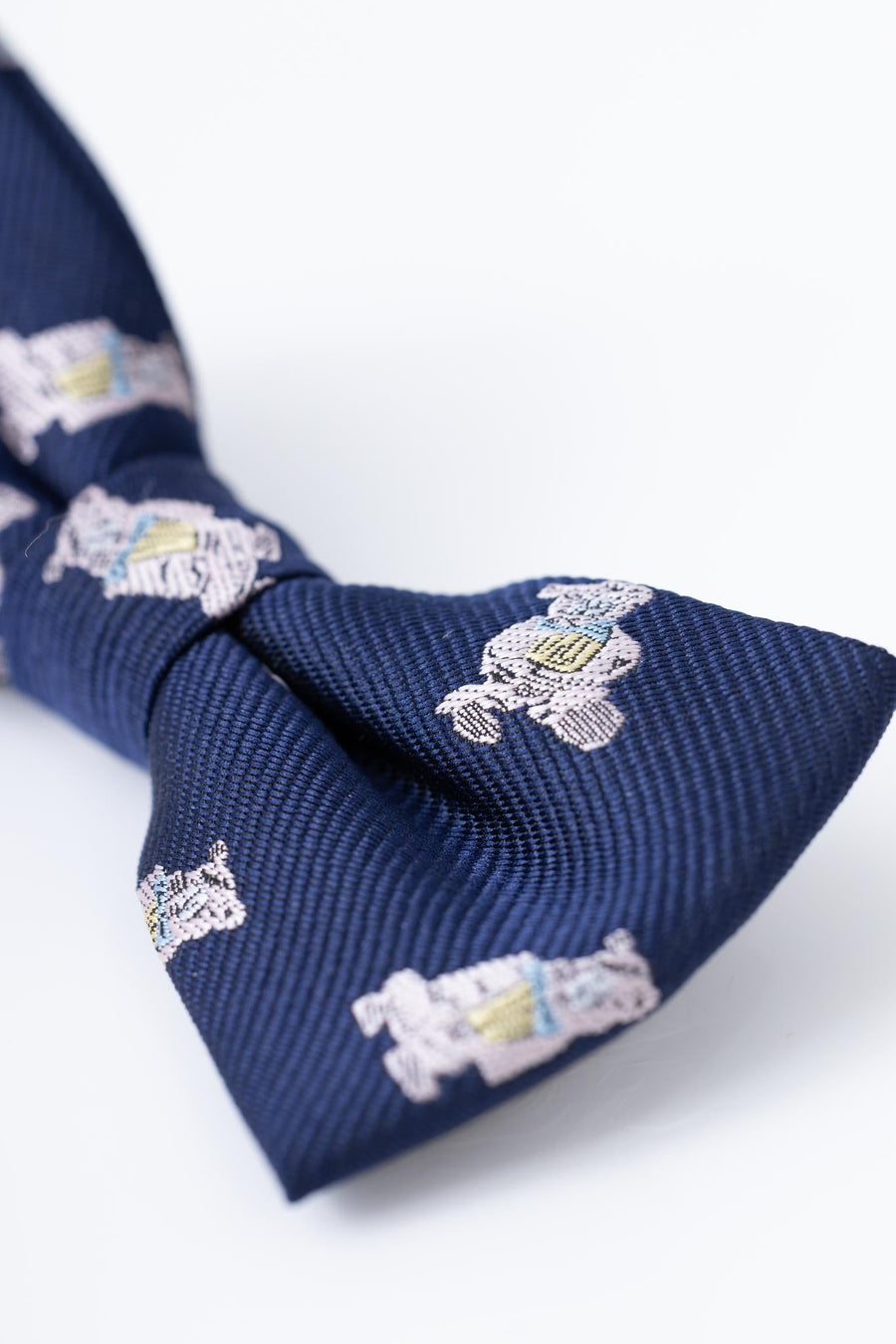 Close-up of the KIKI and JOJO Kids Bow Tie – Navy Blue Bear, a pre-tied satin accessory with an adjustable fit, crafted from premium quality fabric.