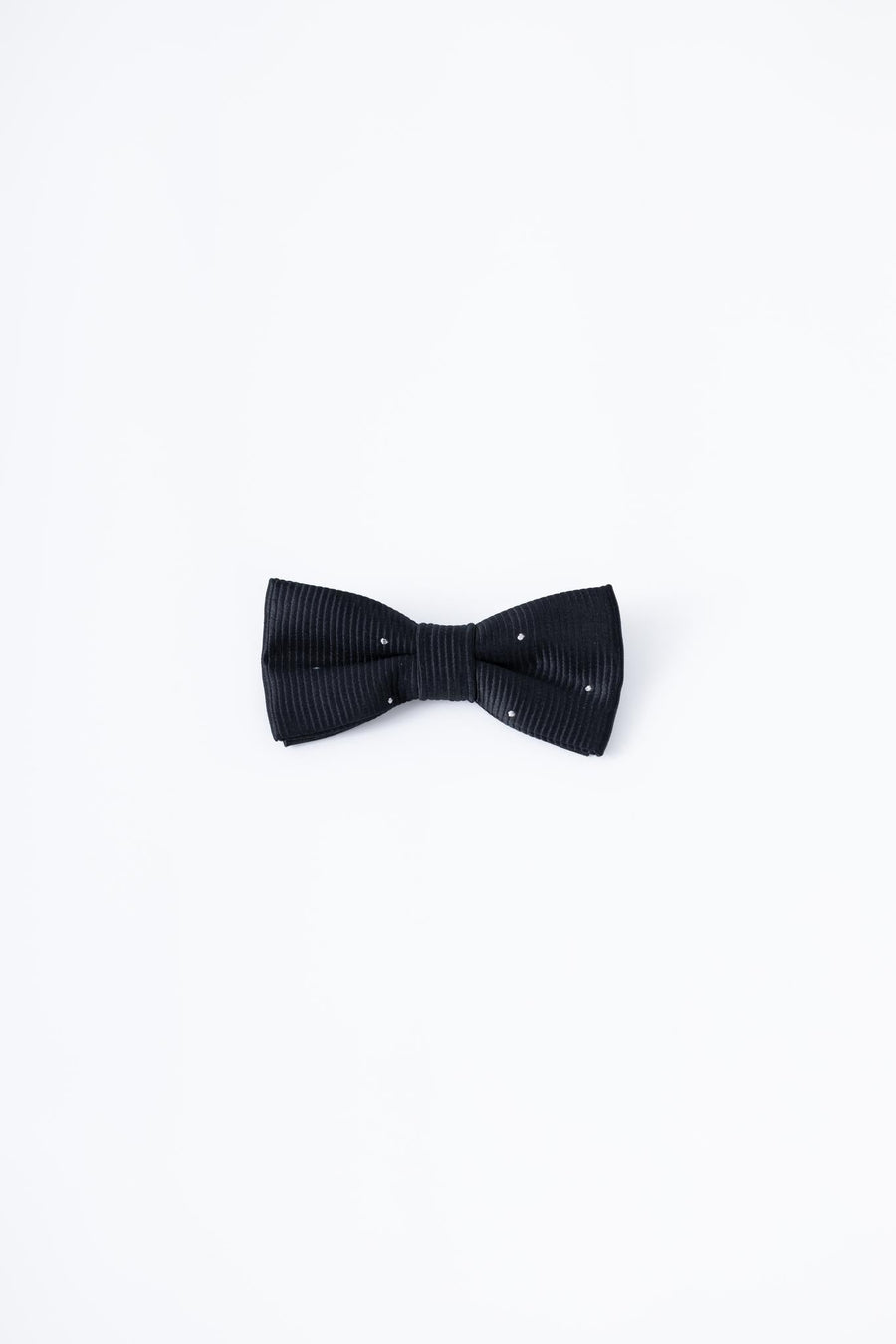 The KIKI and JOJO Kids Bow Tie features a black satin fabric with white dots, pre-tied for convenience and adjustable for comfort; displayed against a plain white background, it pairs perfectly with any kids dress shirt.
