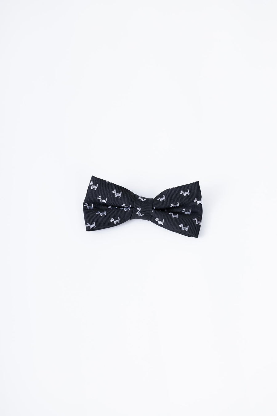 The KIKI and JOJO Kids Bow Tie – Black Puppy features a pre-tied, adjustable satin design with a charming white puppy pattern, shown on a plain white background.
