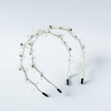 Two Beaded Flower Girl Headbands by KIKI and JOJO feature gold wire-wrapped designs with clear beads and black tips—perfect delicate accessories for special occasions.