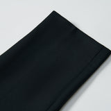 Close-up of KIKI and JOJO's Noir Bloom Suit Pants for boys, showing the straight-leg cut, hem, and fabric texture laid flat on a white surface—perfect formalwear.