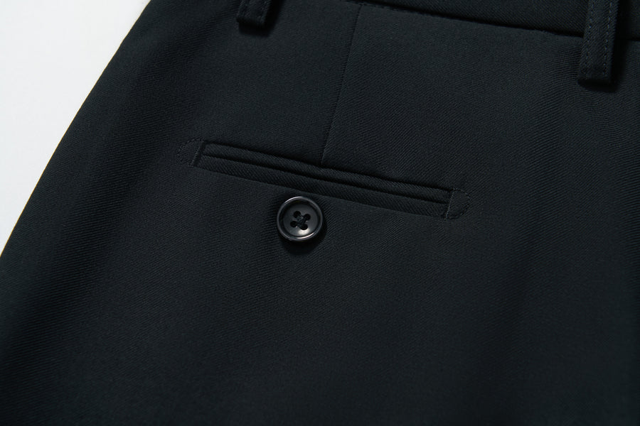 Close-up of KIKI and JOJO’s Noir Bloom Suit Pants for boys, featuring a straight-leg cut, tailored stitching, belt loops, and a black button—ideal for formal occasions.