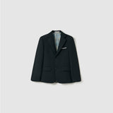 The Noir Bloom Suit Jacket by KIKI and JOJO is a boys' black suit jacket with classic notched lapels, two buttons, a white pocket square, and front flap pockets, shown on a plain light gray background.