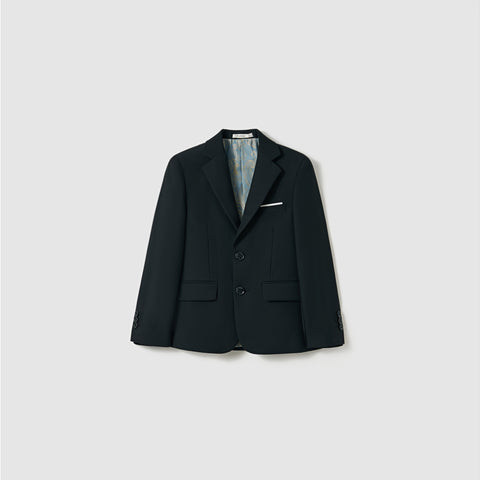 The Noir Bloom Suit Jacket by KIKI and JOJO is a boys' black suit jacket with classic notched lapels, two buttons, a white pocket square, and front flap pockets, shown on a plain light gray background.