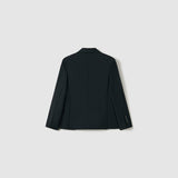 The Noir Bloom Suit Jacket by KIKI and JOJO is shown from the back against a light gray background. This boys' black tailored jacket features long sleeves with buttoned cuffs and a classic notched lapel for timeless style.