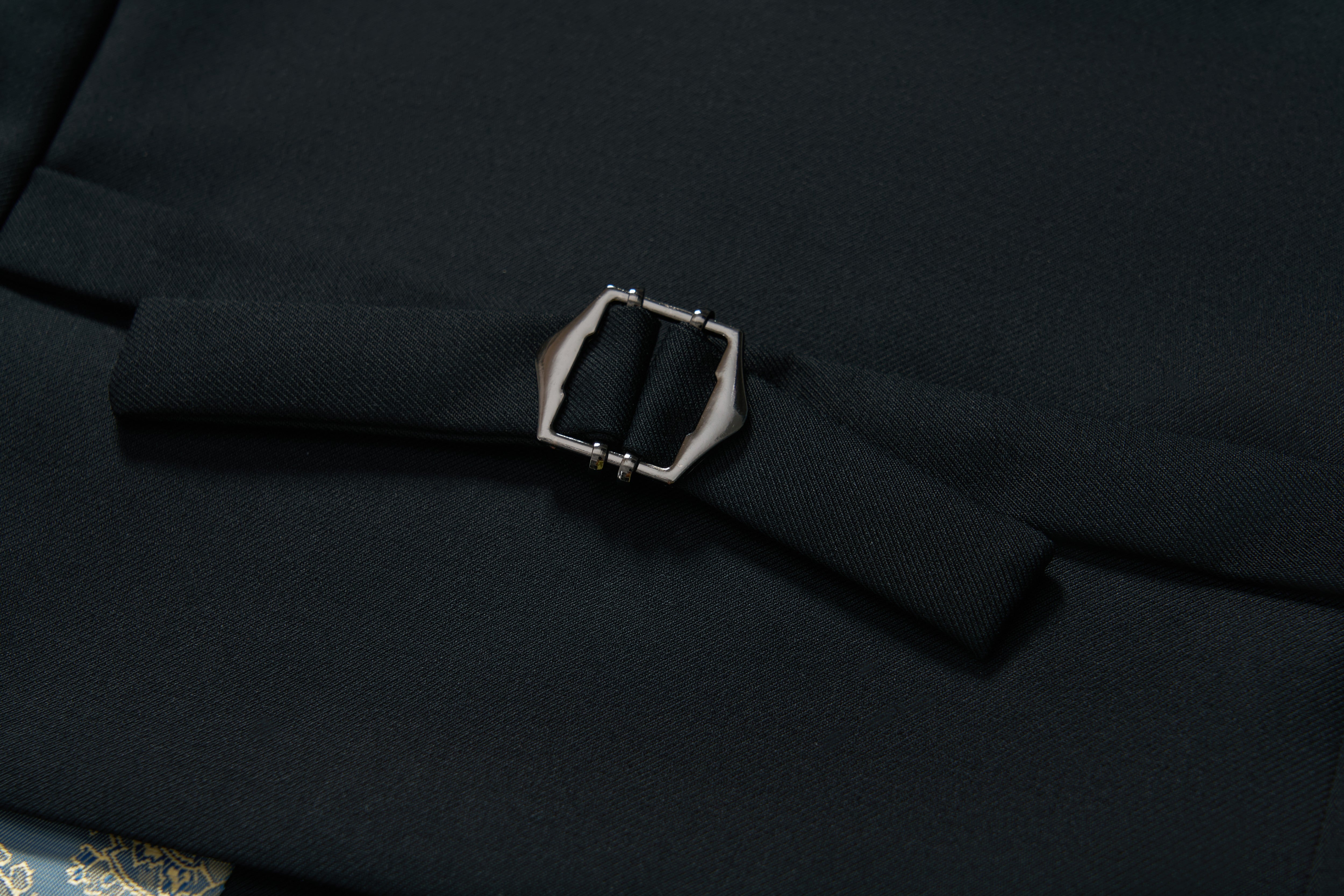Close-up of the Noir Bloom Suit Vest by KIKI and JOJO, featuring a black fabric belt with a rectangular silver buckle—an essential addition to any formal wardrobe.
