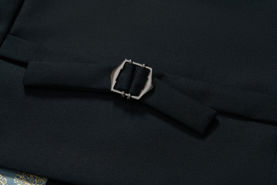Close-up of the Noir Bloom Suit Vest by KIKI and JOJO, featuring a black fabric belt with a rectangular silver buckle—an essential addition to any formal wardrobe.